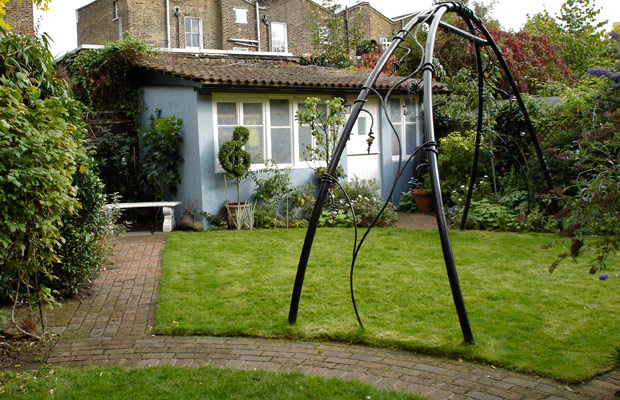Bespoke ornamental arch in family garden - Carol Whitehead garden design