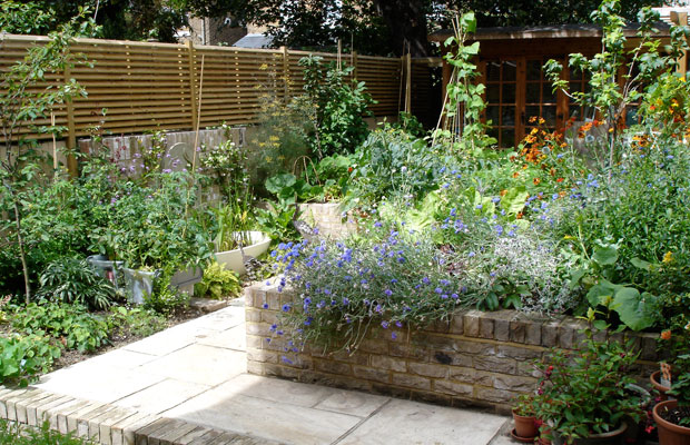 raised beds in an ornamental kitchen garden in hackney by carol whitehead garden design