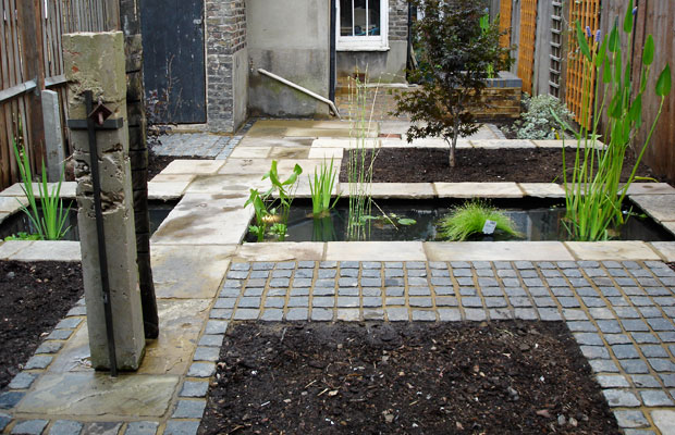 Cobbles and slabs around pond - Carol Whitehead garden design