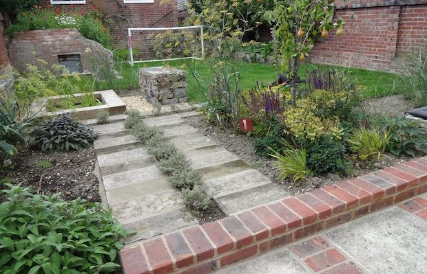 Herb path near pear tree with recycled path - Carol Whitehead garden design