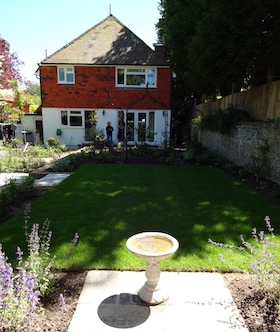 cloister garden neputa and bird bath in sunshine