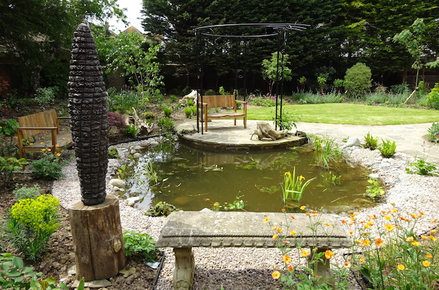 sculpture, pergola, seat at pond side